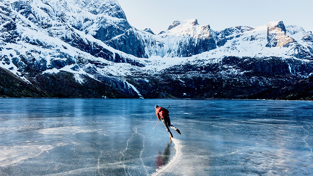 Back view of a person ice skating on a frozen lake-1200x675px.jpg