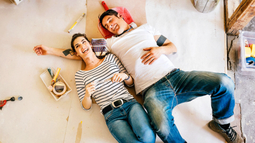 happy couple takes a break from house renovating